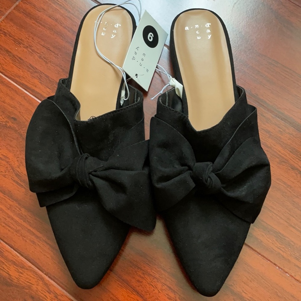 NWT black slip on mules with oversized bow detail